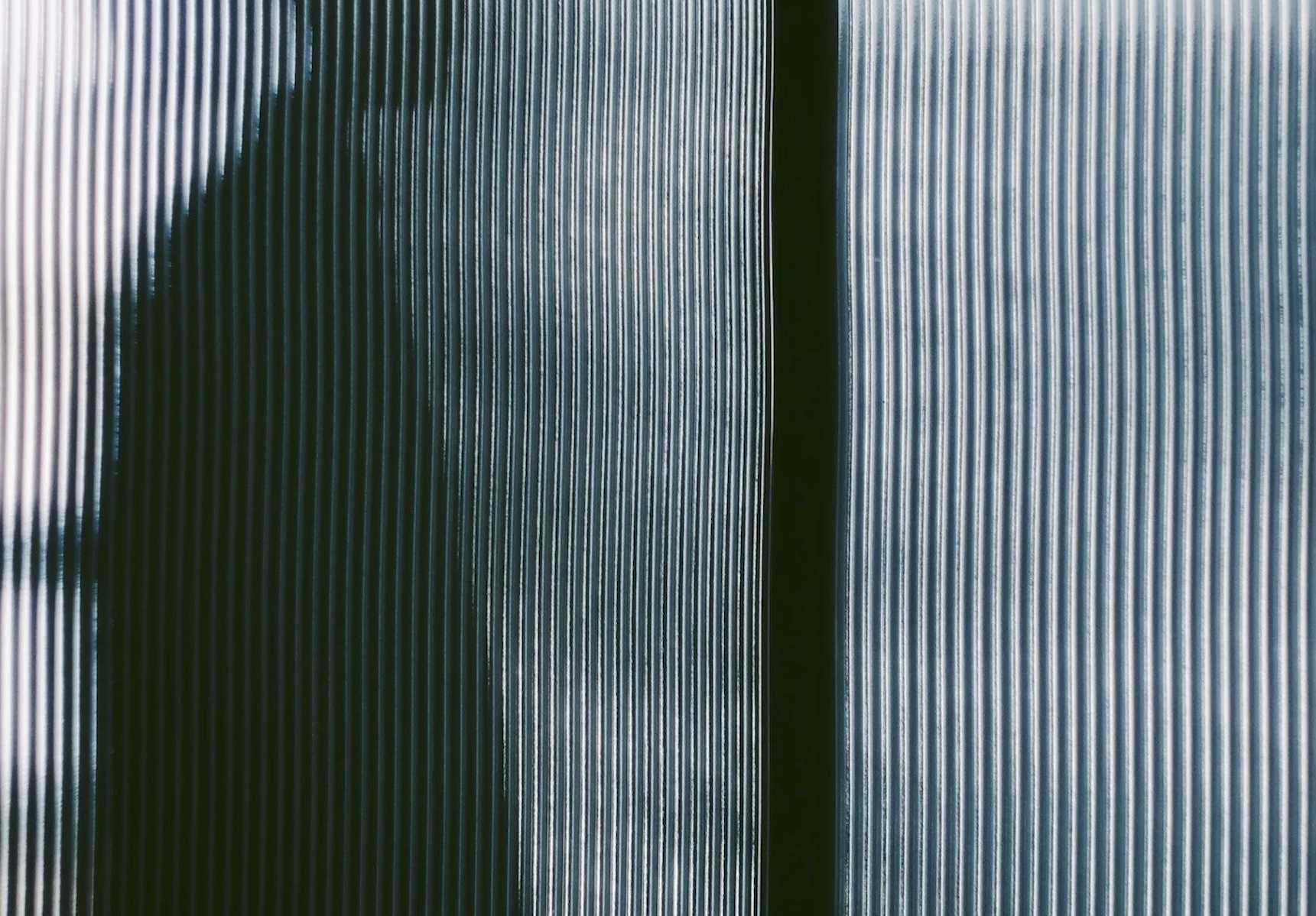 Abstract GHSTMEAT press image behind ribbed glass